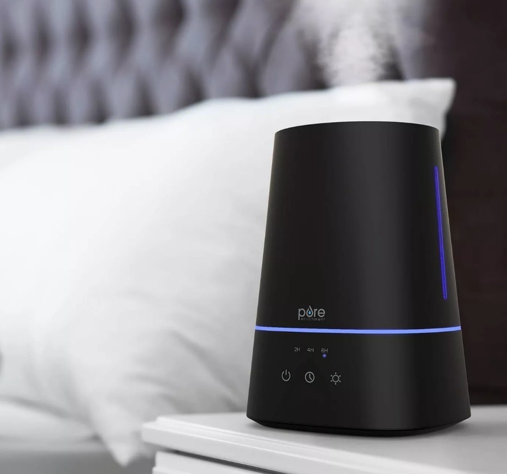 A black humidifier on a night-table