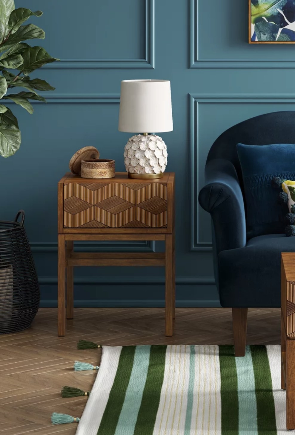 the accent table next to a couch with a lamp on top