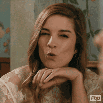 Alexis from &quot;Schitt&#x27;s Creek&quot; making a funny expression.