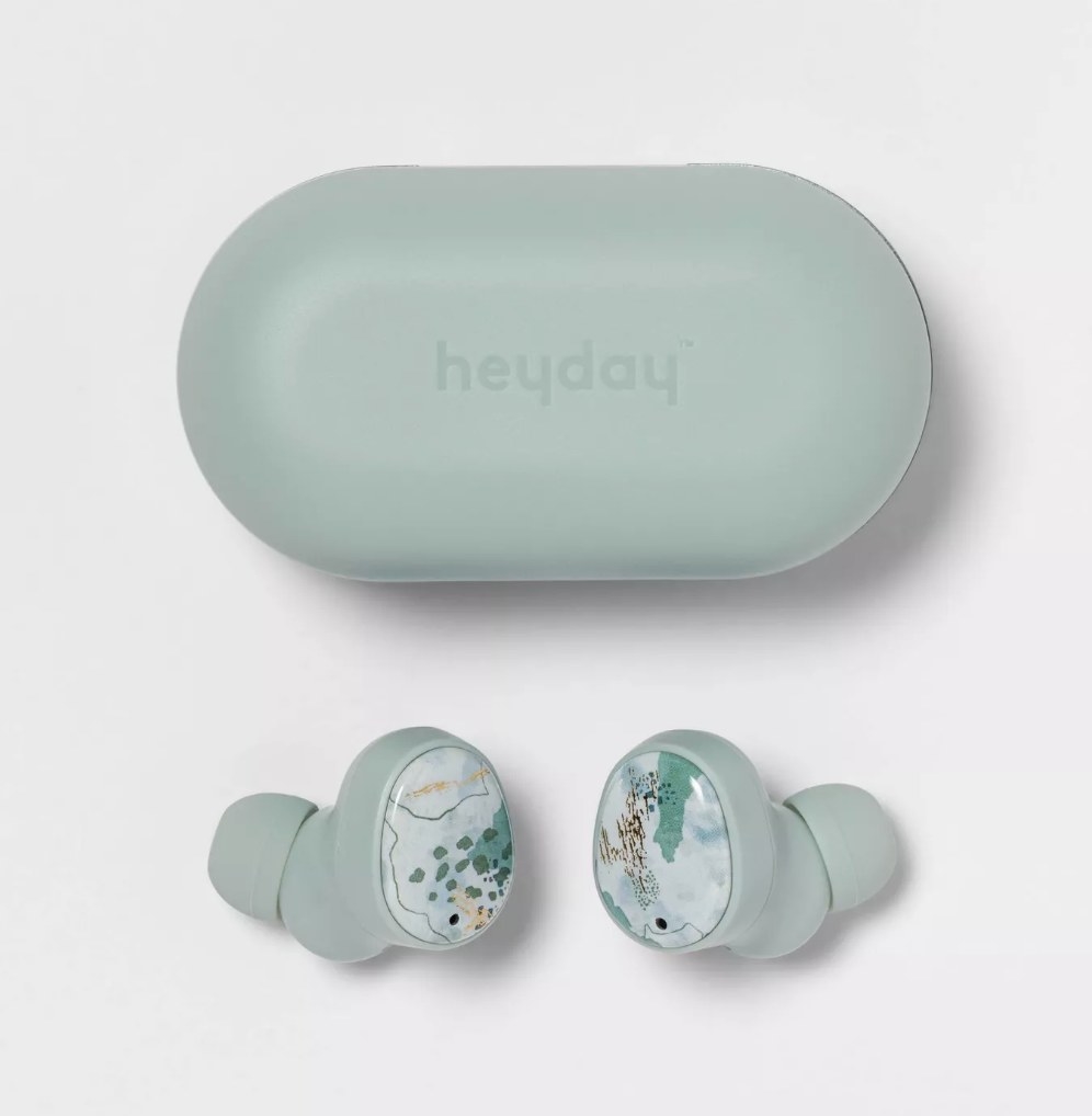 A pair of powder blue, wireless, noise-canceling earbuds with a matching charging case