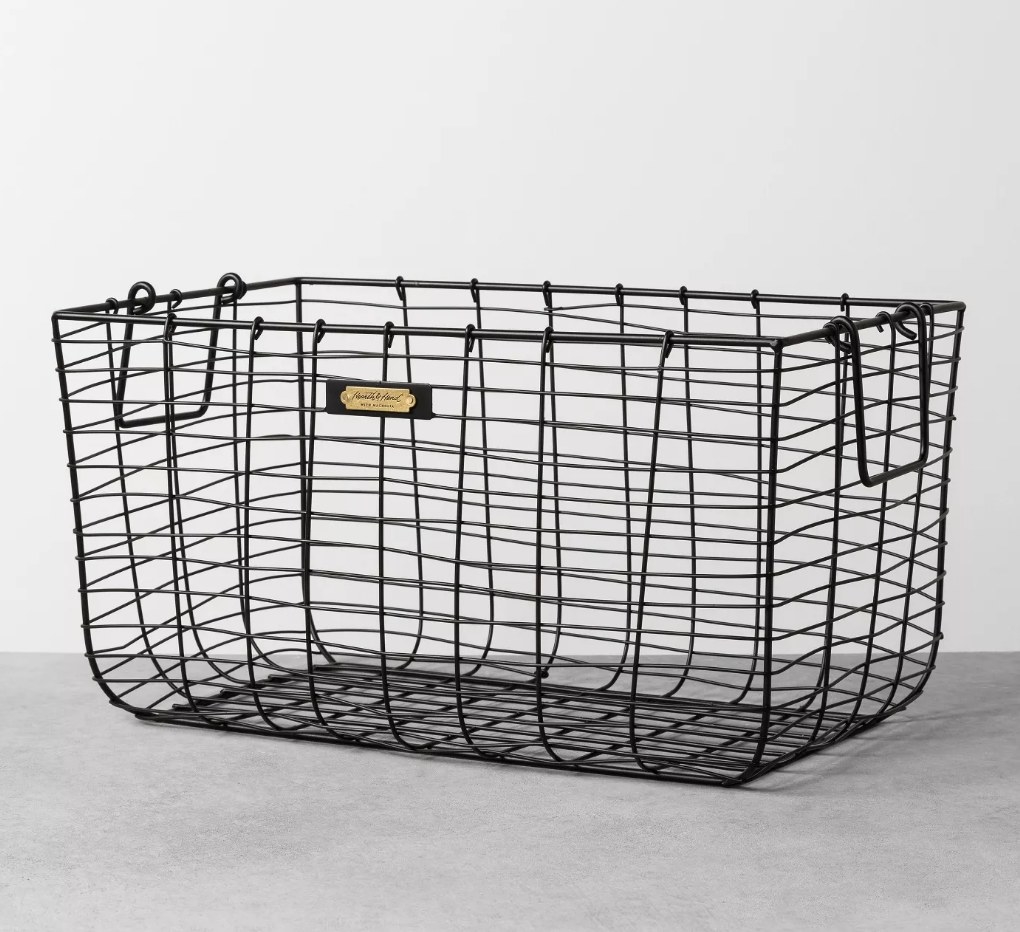 A black, wire storage basket