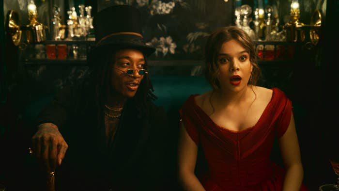 Emily with her mouth open in shock as she sits next to Wiz Khalifa, who portrays the character of Death