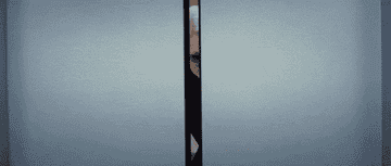 A gif of Miranda Priestly from Devil Wears Prada walking out of an elevator in style