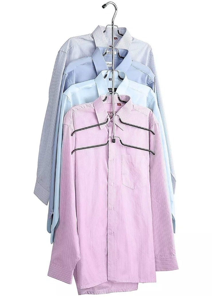 A 6-tier blouse hanger holding 5 button down shirts