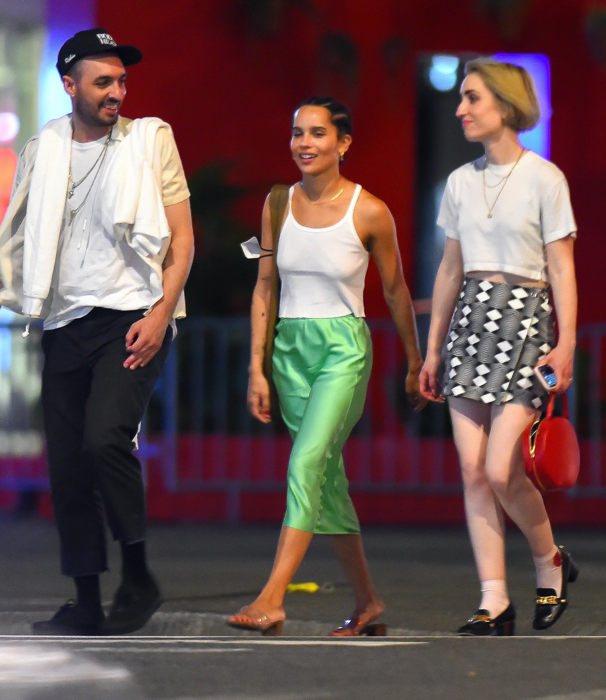 Zoe with friends on the NYC streets wearing tank, skirt, and slides