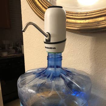 a review photo of the dispenser on a water jug