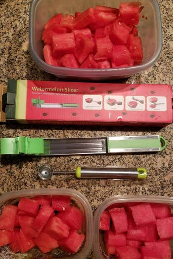 a reviewer photo of the slicer surrounded by containers filled with cubed watermelon 