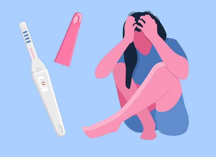 woman distressed with positive pregnancy test