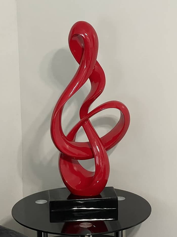 reviewer image of the red sculpture on a side table