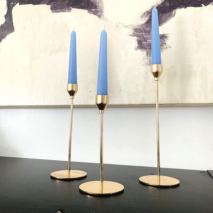 reviewer's set of black candlestick holders in gold