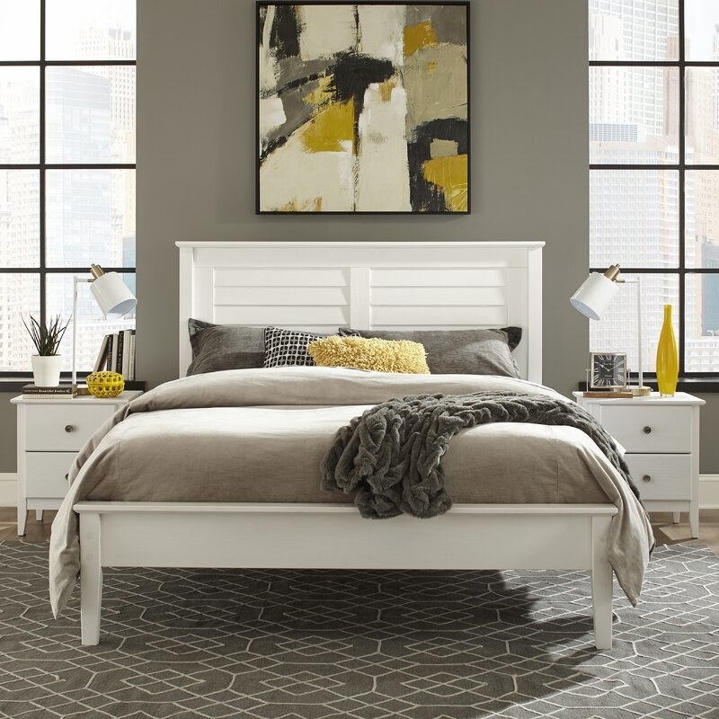The brushed white bed displayed in a bedroom