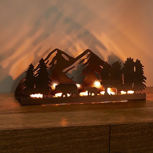 tealight holder casting mountain shadows on the wall