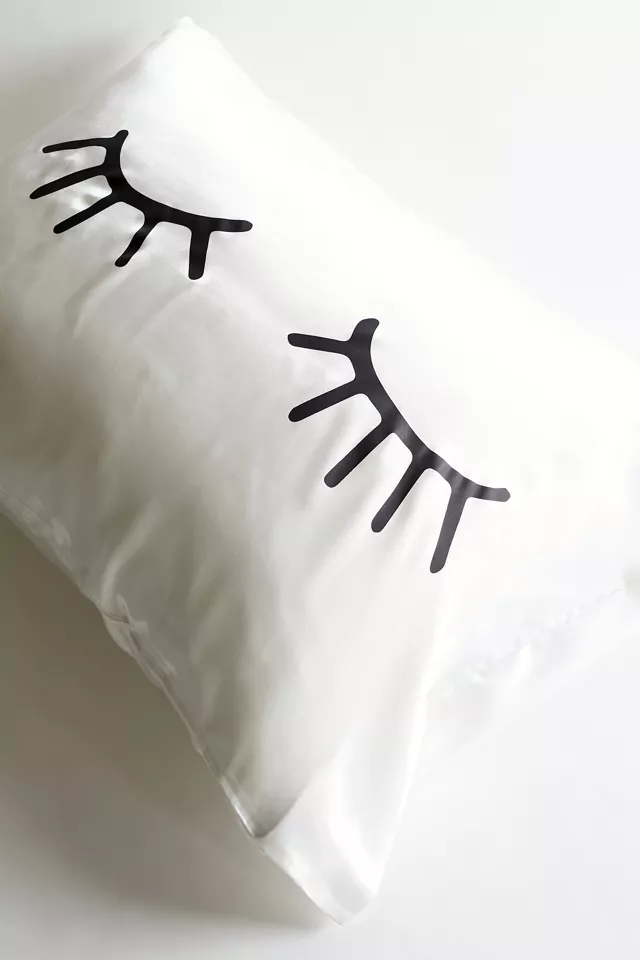 A pillowcase with lashes drawn on it