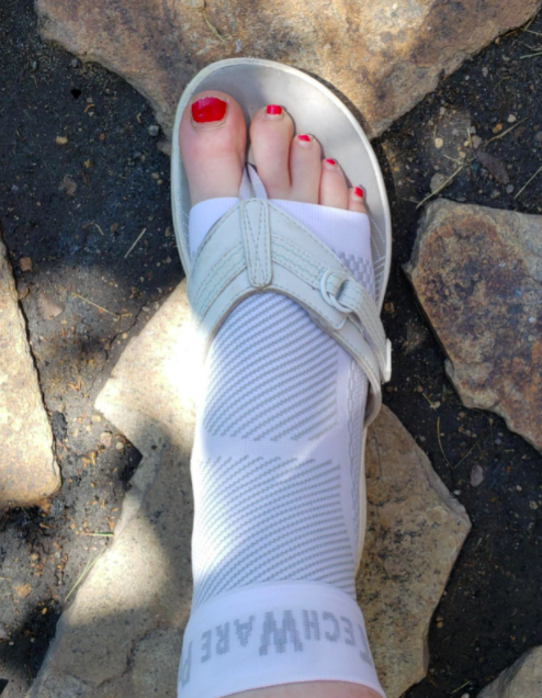 Reviewer wearing the braces with sandals