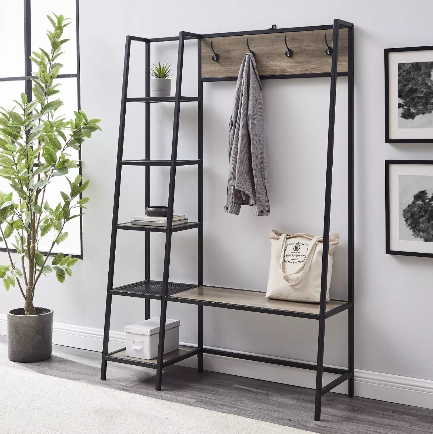 the hall tree with a bag and coat hanging on it