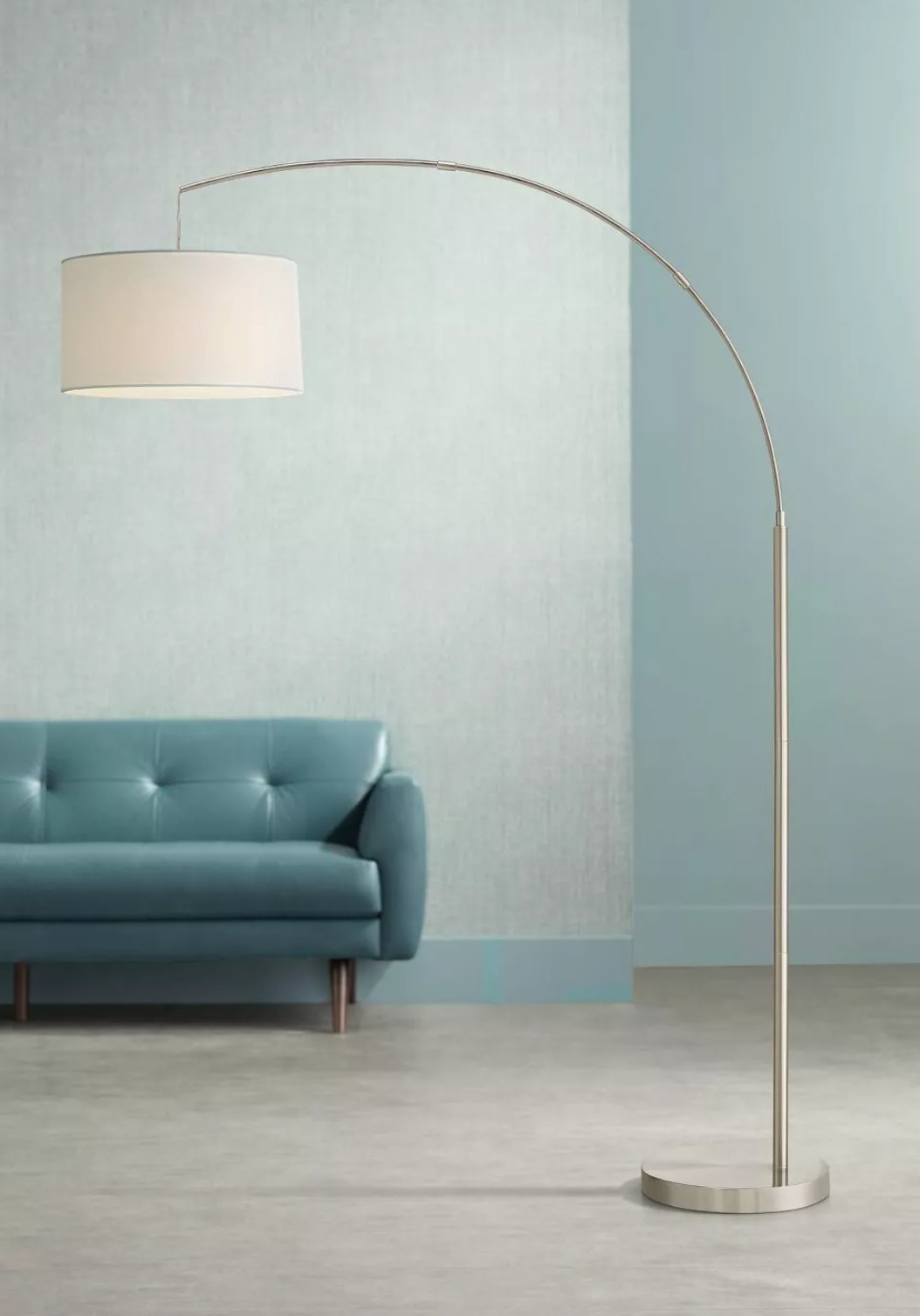 the lamp next to a blue couch