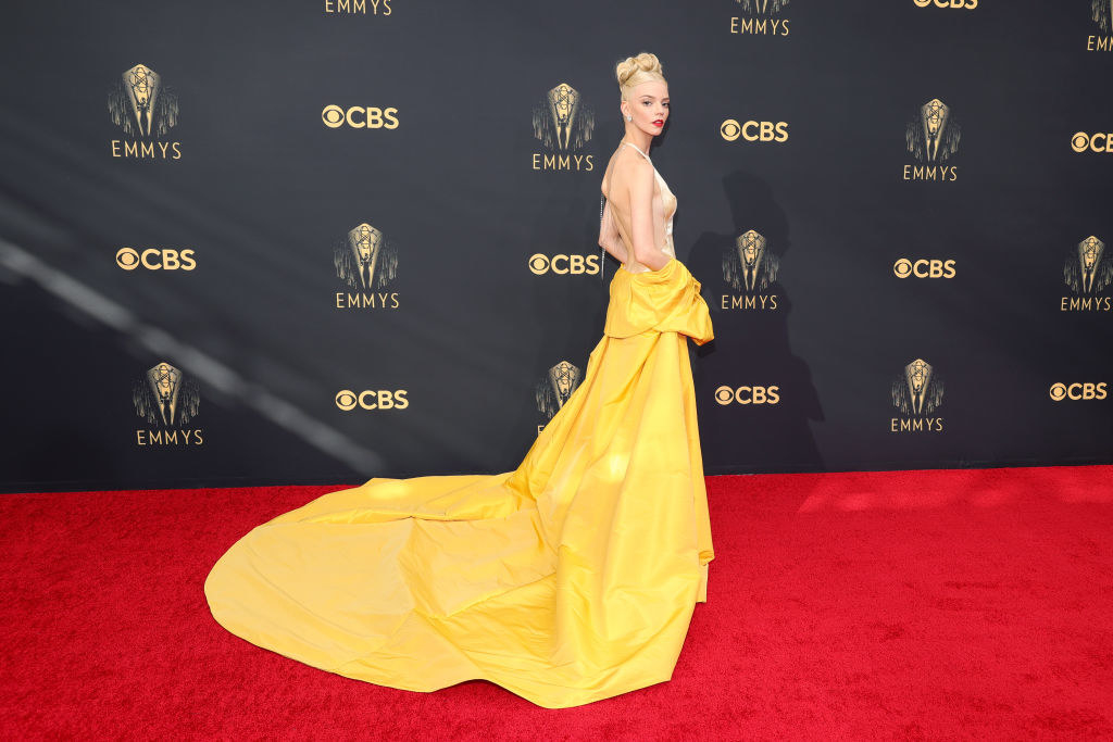 Anya Taylor-Joy on the red carpet in a long yellow gown