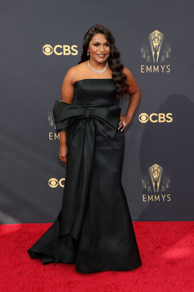 Mindy Kaling on the red carpet in a black gown