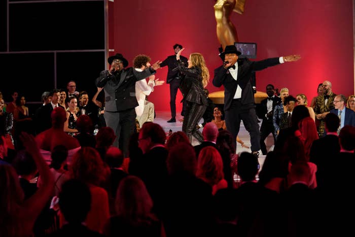 Host Cedric the Entertainer rapping onstage with others during the show&#x27;s opening