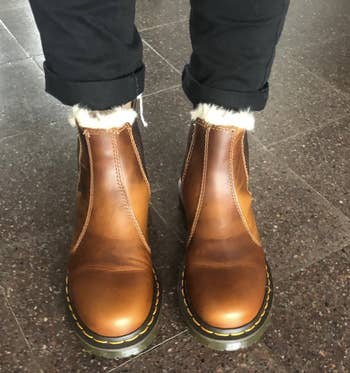 reviewer wearing brown boots 