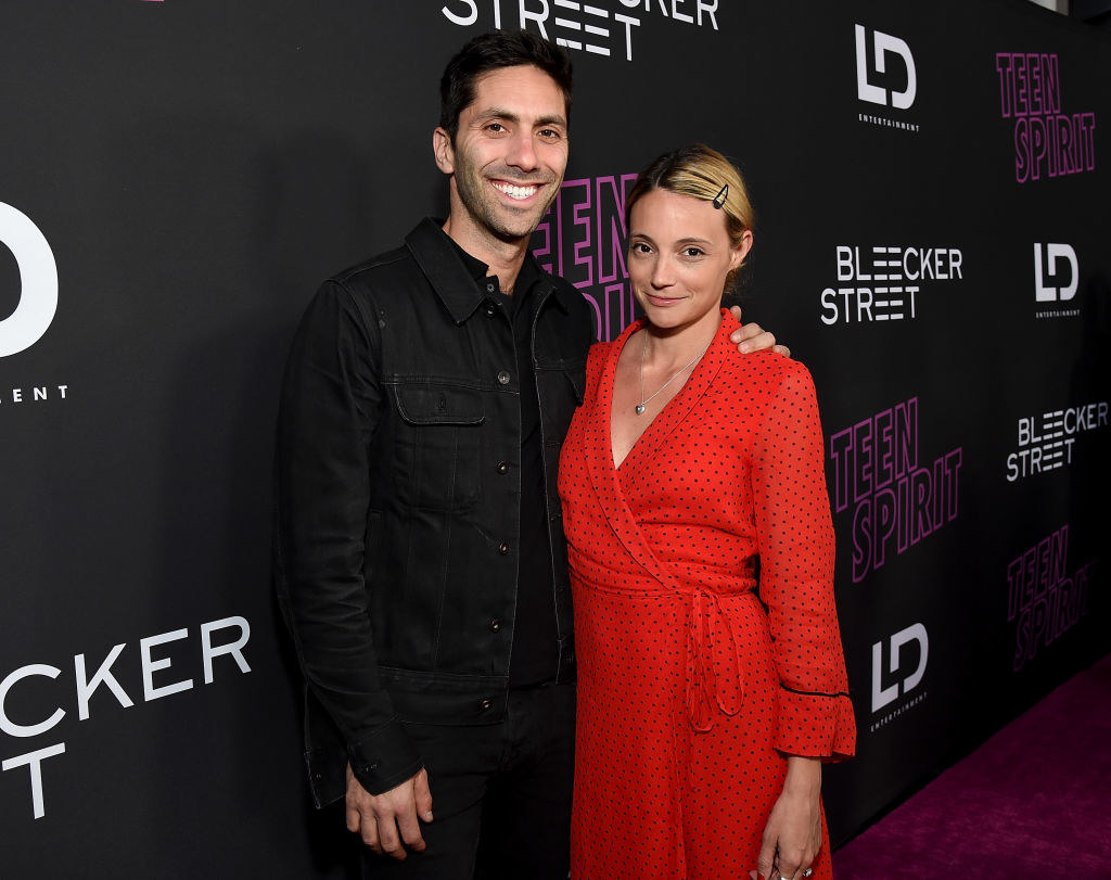 Nev Schulman and Laura Perlongo smiling on the red carpet