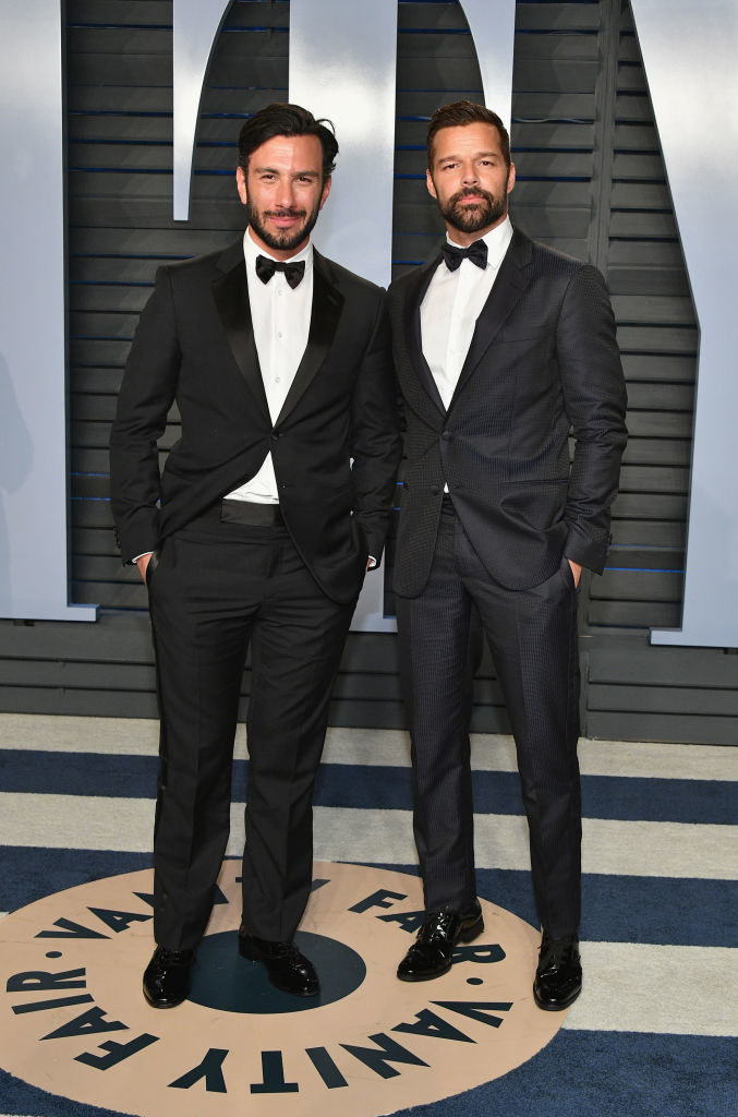 Jwan Yosef and Ricky Martin in bow ties and hands in pocket, standing together