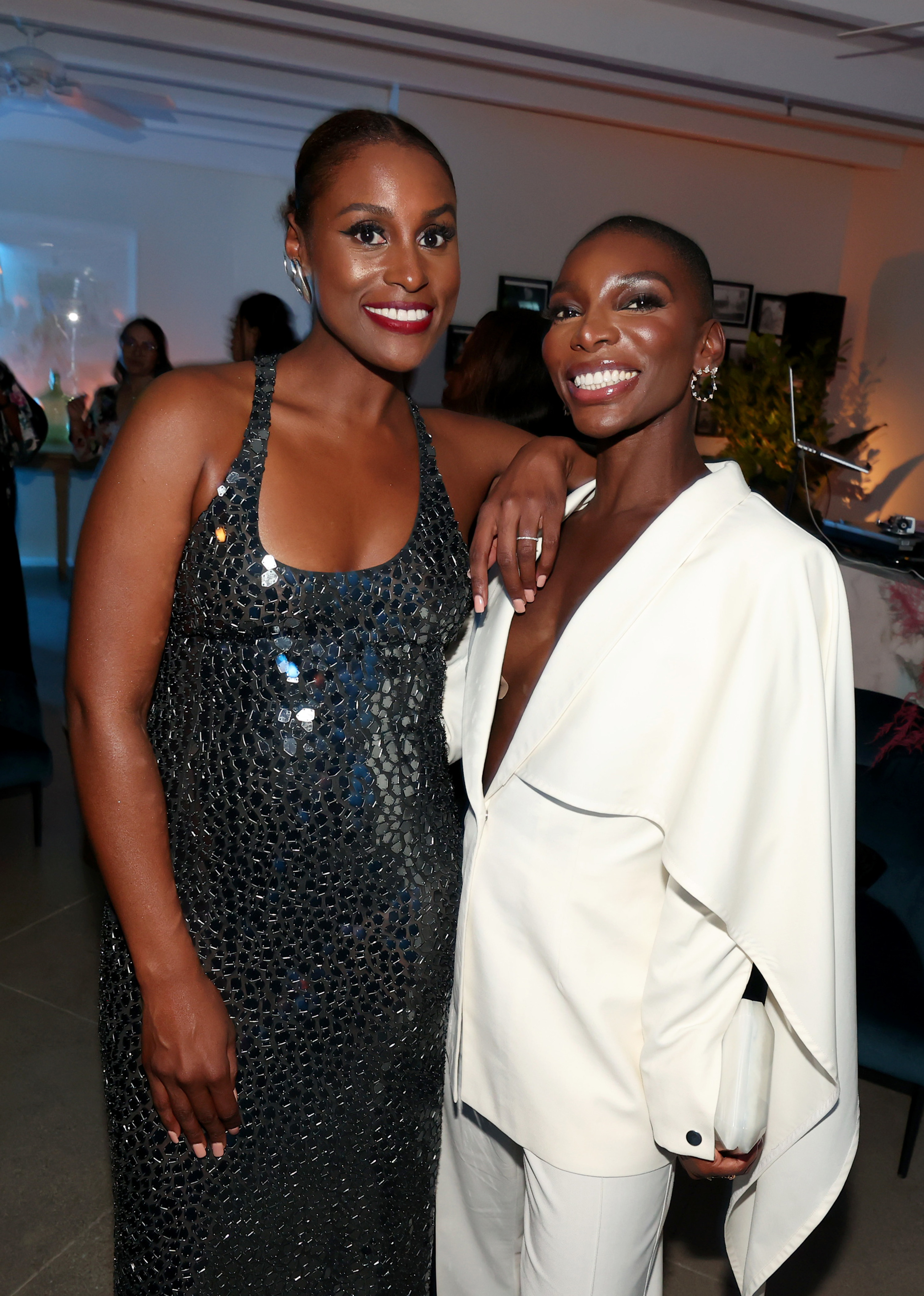 Issa Rae and Michaela standing and smiling at an event