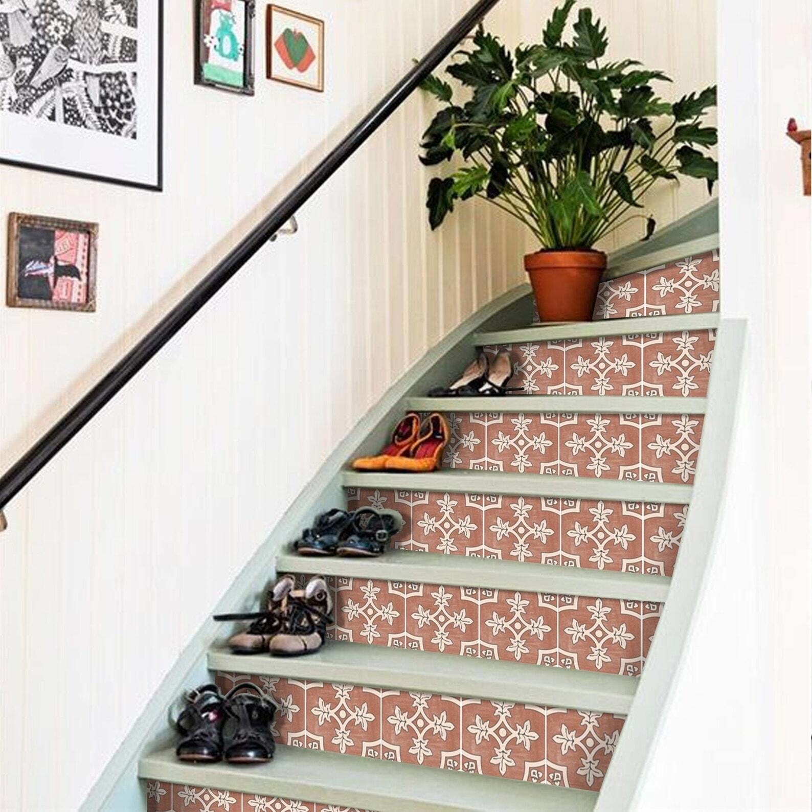 curved staircase with stickers on the risers that look like real tile