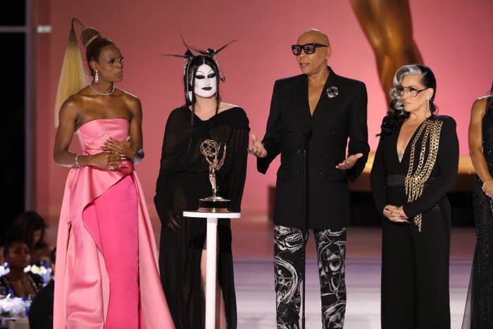 RuPaul on stage accepting the award with several members of the cast and crew