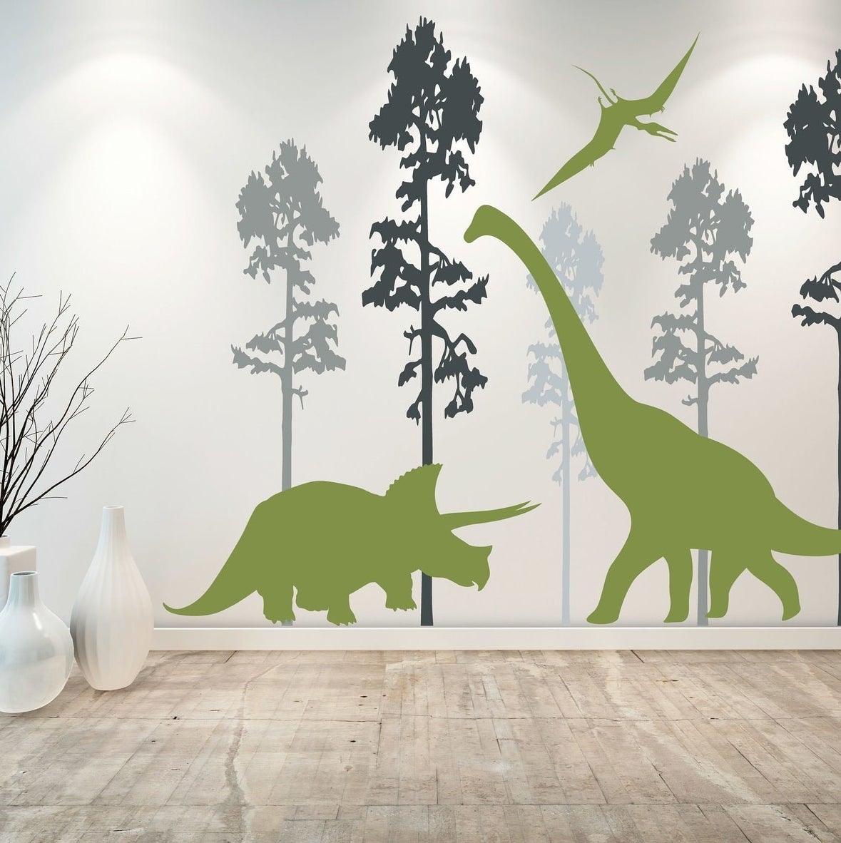 Three green dinosaur wall decals with trees in various shades of blue