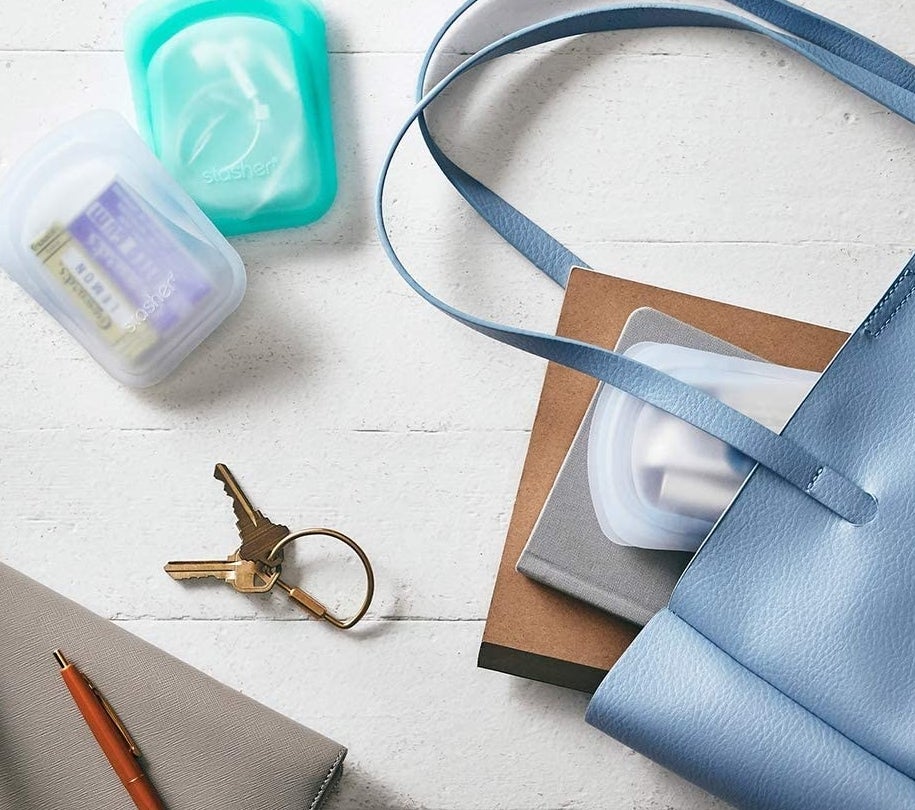 A pair of pocket-sized silicone bags spilling out of a purse
