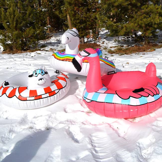 Polar bear, unicorn, and flamingo inflatable snow tubes