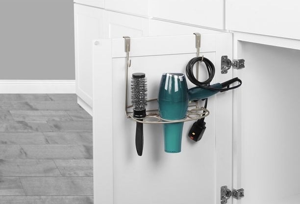 Over-the-cabinet organizer holding hair styling products.