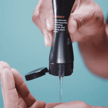 gif of someone squeezing the bottle of cleanser showing the consistency of the formula
