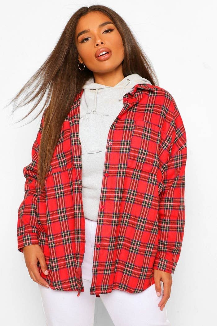a model in a red flannel shirt