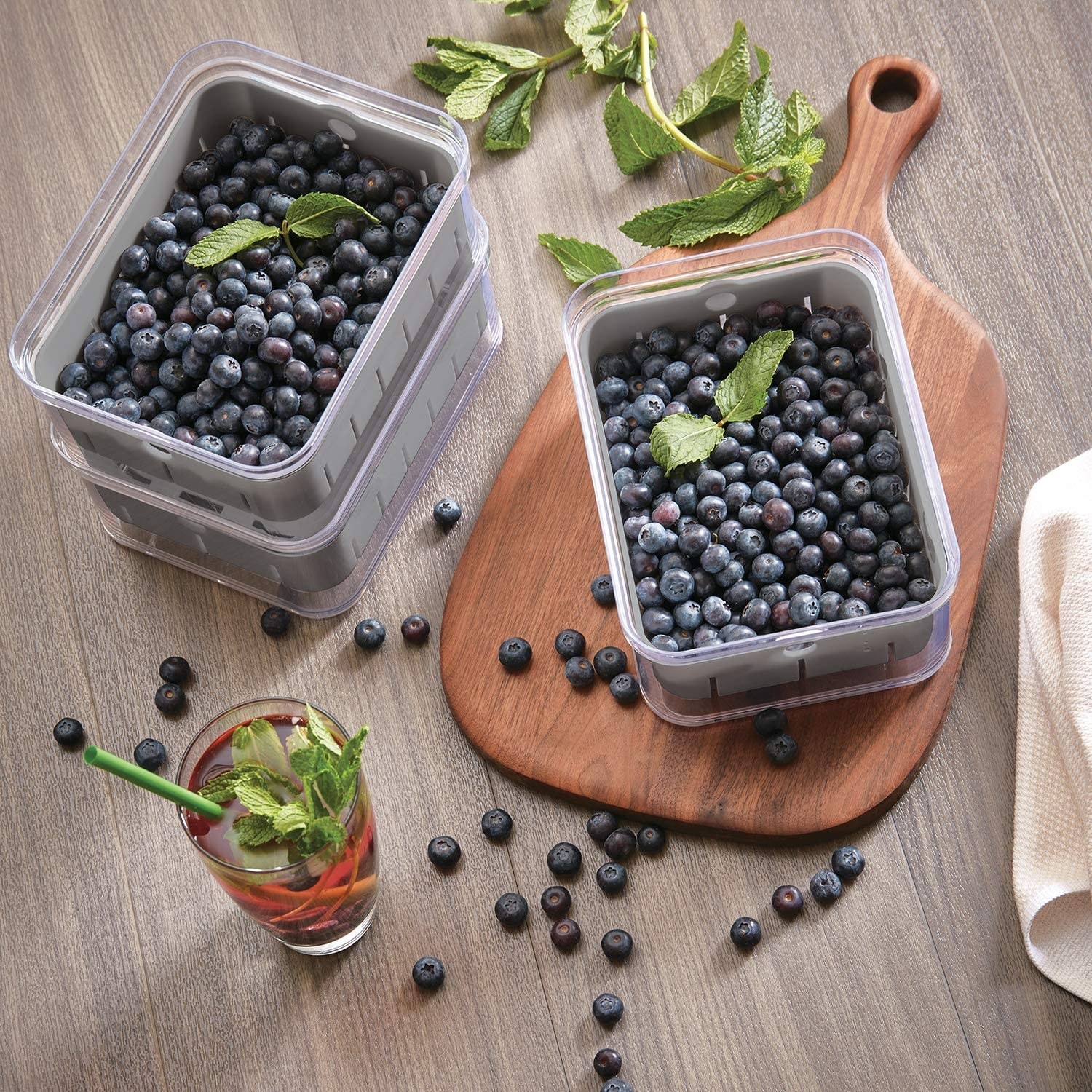 a trio of produce boxes containing blueberries