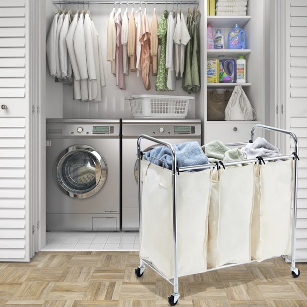 Laundry sorter in front of washer and dryer.