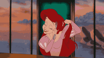 Ariel from The Littler Mermaid brushing her hair with a fork