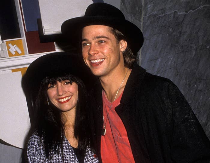 Brad and a girlfriend wear matching black hats