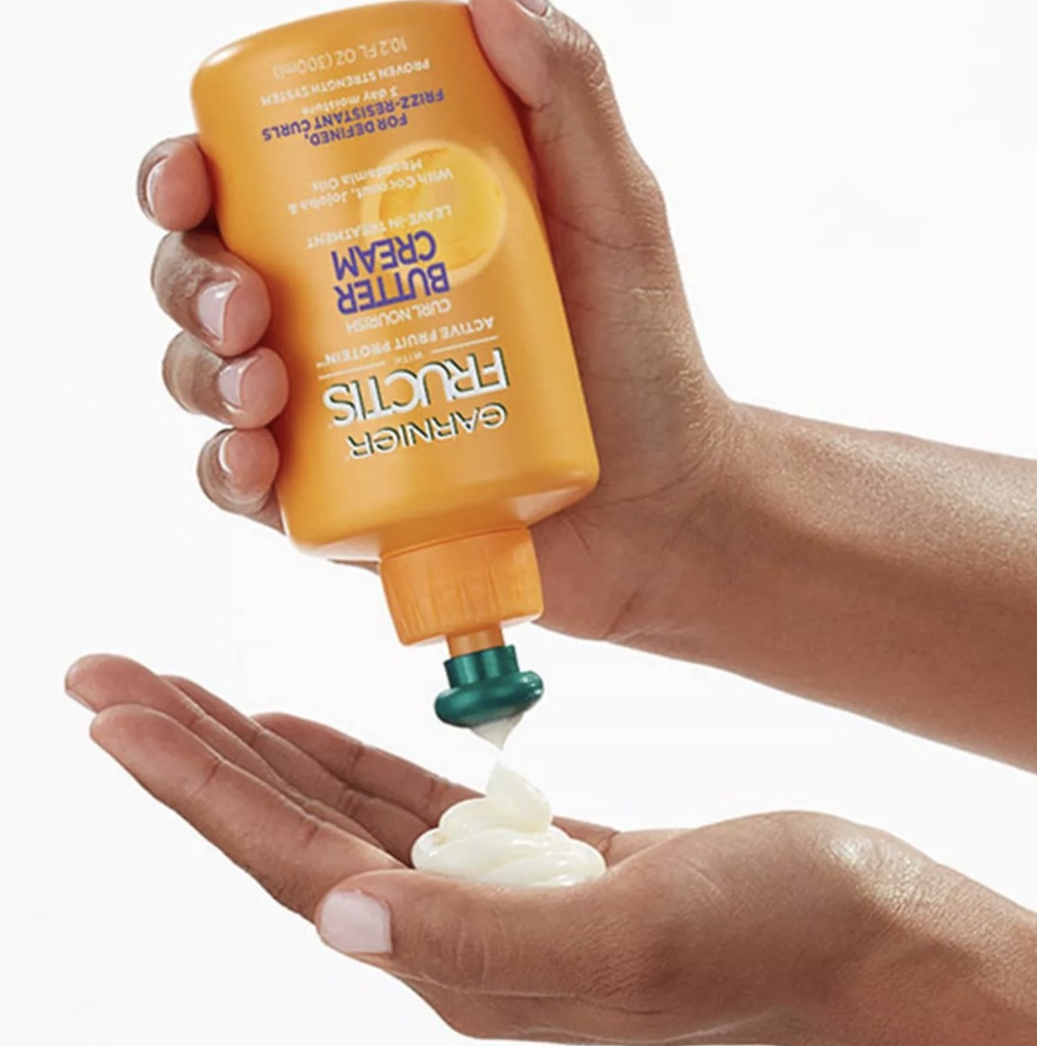 the cream being poured into someones hands