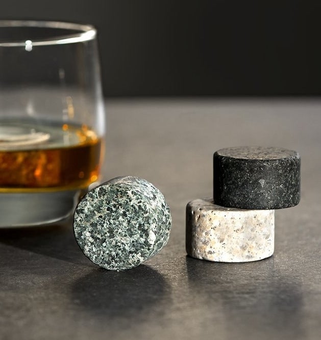 Whisky stones next to a glass of whisky
