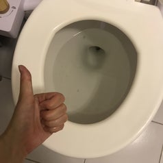 the same toilet looking clean