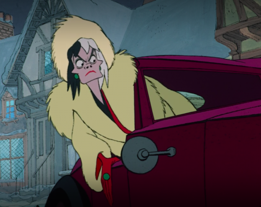 Cruella hangs out her car window to watch the puppies escape