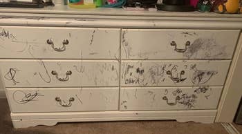 before of a reviewer's white dresser covered in scribbles made with a black permanent marker
