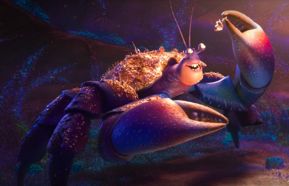 a giant bedazzled hermit crab dangles Moana in the air