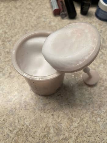 Inside of Marshmallow Whip Maker with foamy cleanser inside