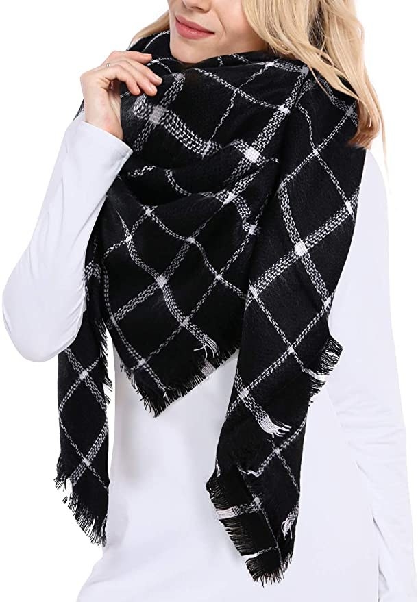 model wearing the black and white plaid scarf