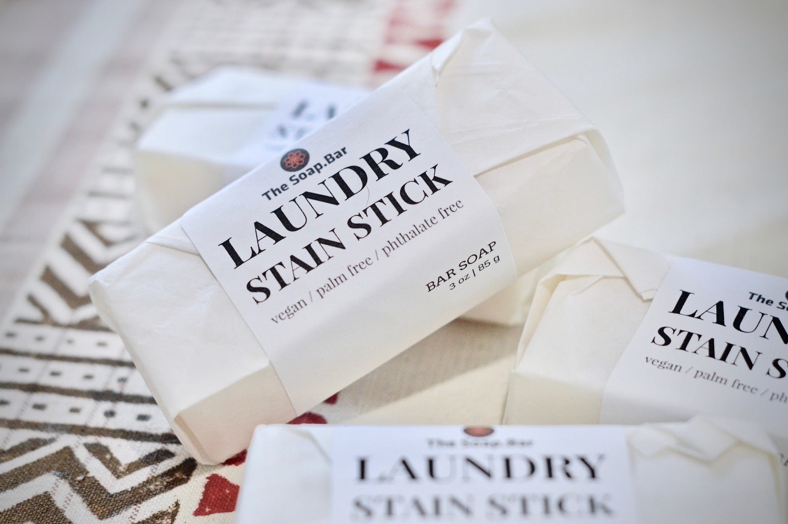 vegan laundry stain sticks wrapped in white paper on table