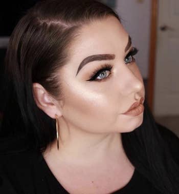 reviewer with the golden highlighter on cheekbones