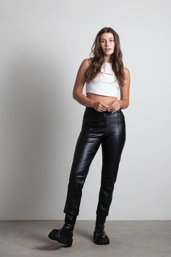 model wearing the black faux leather pants